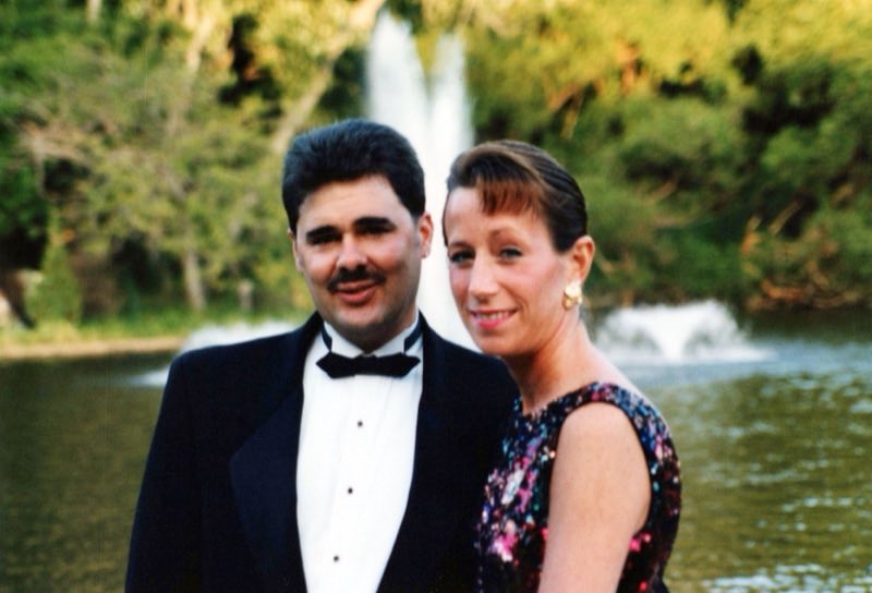 Lou and Rose in evening dress before a fountain